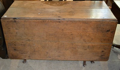 Lot 1179 - A 19th century mahogany drop leaf dining table,...