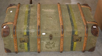 Lot 1169 - An early 20th century travel trunk, with green...