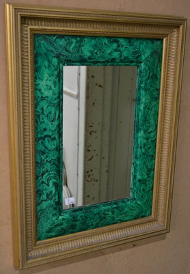 Lot 1029 - A 20th century wall mirror, with green faux...