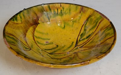 Lot 826 - A Persian terracotta bowl, decorated with line...