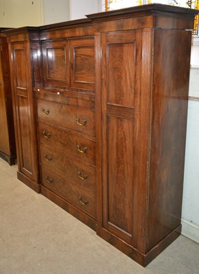 Lot 1042 - A 19th century mahogany press cupboard, the...