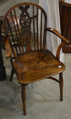 Lot 1186 - A late 19th century wheel back carver chair,...