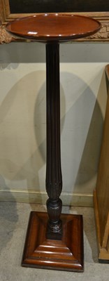 Lot 1209 - A 20th century mahogany torchere / display...