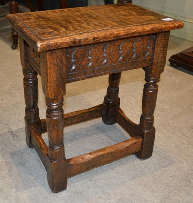 Lot 1198 - A 17th century / later oak stool, featuring...