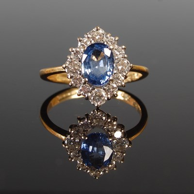 Lot 347 - An 18ct yellow and white gold sapphire and...