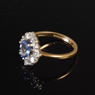 Lot 347 - An 18ct yellow and white gold sapphire and...