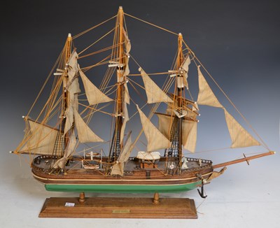 Lot 582 - A 20th century model of a ship, raised on a...