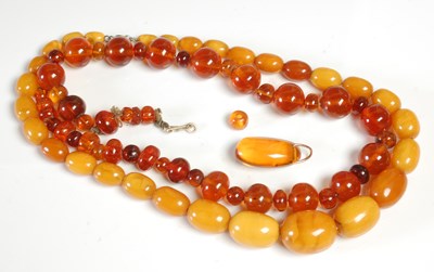 Lot 303 - A vintage butterscotch amber graduated bead...