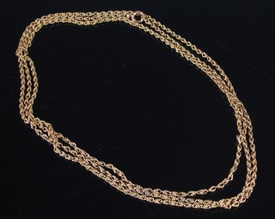 Lot 313 - A long yellow metal rope twist necklace, tests...