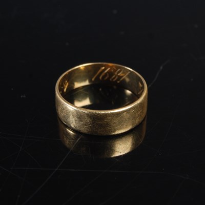Lot 342 - A yellow metal ring of plain form, the inner...