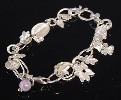 Lot 215 - Malcolm Appleby, a silver charm bracelet, 'A...