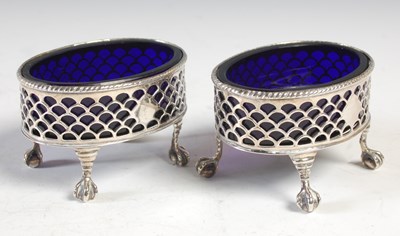 Lot 226 - A pair of George III pierced oval salt cellars,...