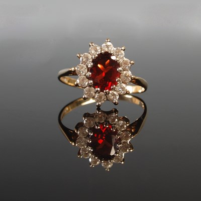 Lot 350 - A 9ct gold garnet and CZ cluster ring, size P,...