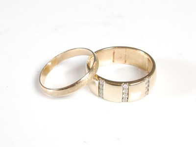 Lot 353 - A yellow metal diamond studded ring, stamped...