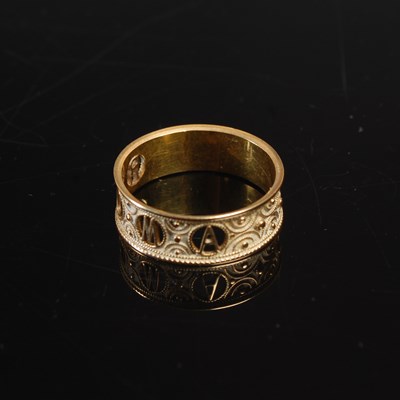 Lot 354 - An Italian yellow metal 'Roma' ring, tests as...