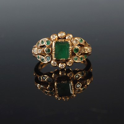 Lot 355 - A yellow metal emerald and diamond cluster...