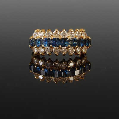Lot 358 - An 18ct gold sapphire and diamond cocktail...