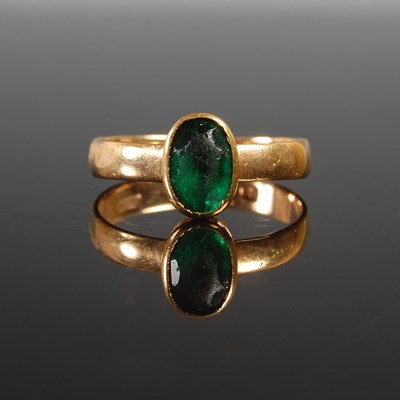 Lot 360 - An 18ct gold and green gemstone single stone...