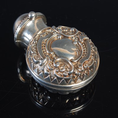 Lot 242 - A late Victorian green glass scent bottle, in...