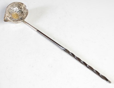 Lot 266 - A silver mounted punch ladle, with embossed...
