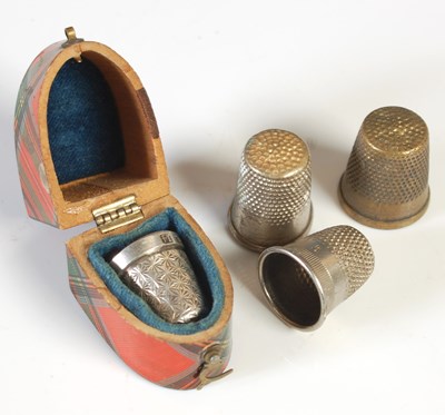 Lot 267 - Three various metal thimbles and a Tartan Ware...
