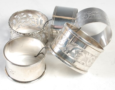 Lot 271 - Five various silver napkin rings, 3.5 troy ozs.