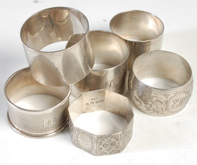 Lot 279 - Six various silver napkin rings, 5.8 troy ozs.