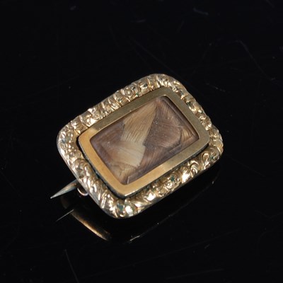 Lot 379 - A late 19th century yellow metal mourning...