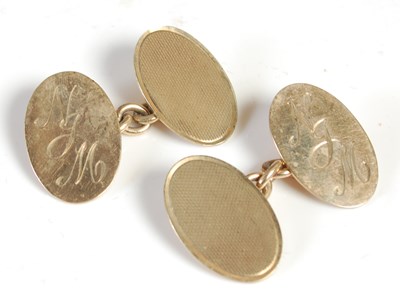 Lot 393 - A pair of 9ct gold cufflinks, each with a...