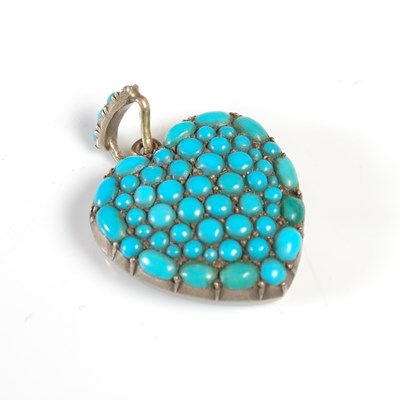 Lot 418 - A yellow metal and turquoise studded heart...
