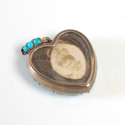 Lot 418 - A yellow metal and turquoise studded heart...