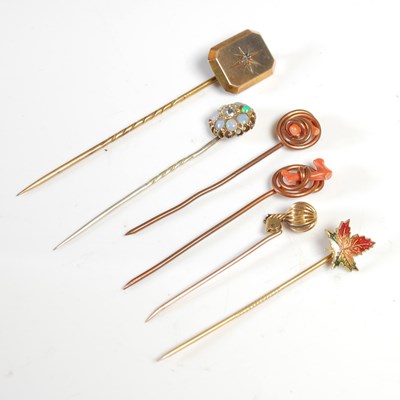 Lot 420 - A group of six assorted stick pins, to include...