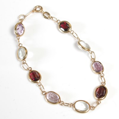 Lot 422 - A 9ct gold and coloured gemstone set bracelet,...