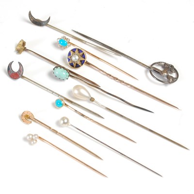 Lot 424 - A collection of ten assorted stick pins and...