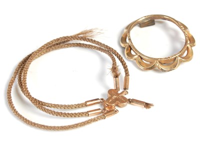 Lot 430 - A yellow metal mounted woven hair bracelet...