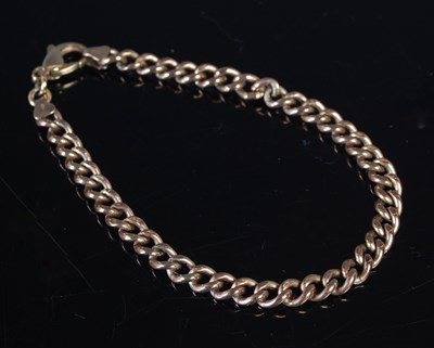 Lot 442 - An Italian yellow metal curb link bracelet,...