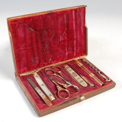 Lot 444 - A gold mounted sewing / manicure set, the...