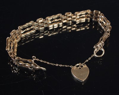 Lot 451 - A 9ct gold bracelet, with heart shaped lock,...