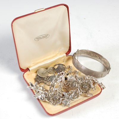 Lot 481A - A white metal charm bracelet; a Sterling...