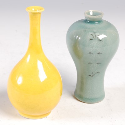 Lot 616 - A Japanese porcelain monochrome bottle vase,...