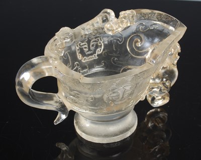 Lot 619 - A Chinese clear glass libation cup, imitating...