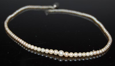 Lot 78 - A single strand graduated pearl necklace with...