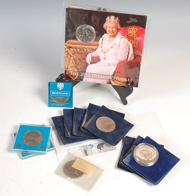 Lot 552 - A collection of assorted coins and banknotes,...