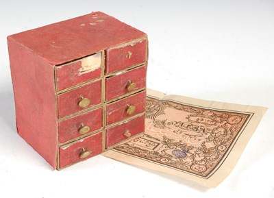 Lot 555 - A small handmade coin cabinet of eight drawers,...