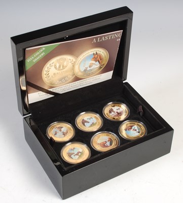 Lot 571 - A box set of twelve 24ct gold plated proof...