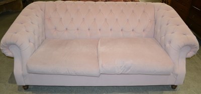 Lot 1156 - A Long Eaton button back two seater sofa in...