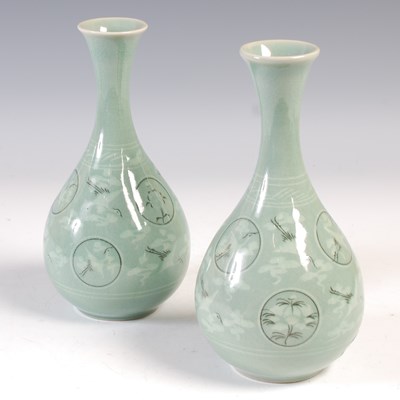 Lot 602 - A pair of South East Asian celadon glazed...