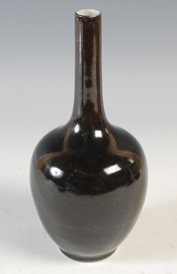 Lot 595 - A Chinese porcelain monochrome bottle vase,...