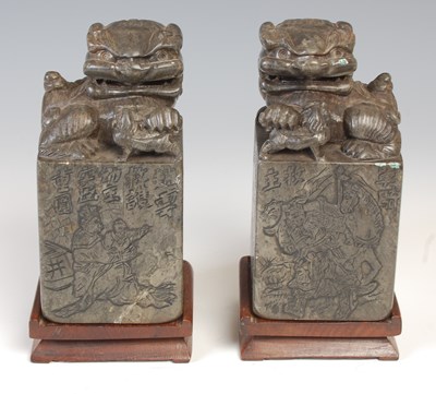 Lot 670 - A pair of Chinese soapstone seals, carved with...