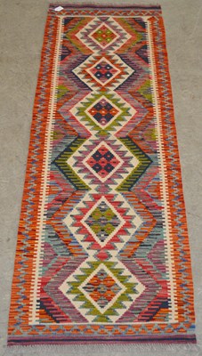 Lot 1212 - A Chobi Kilim runner, worked in coloured...